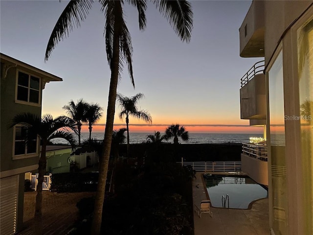 yard at dusk with a water view