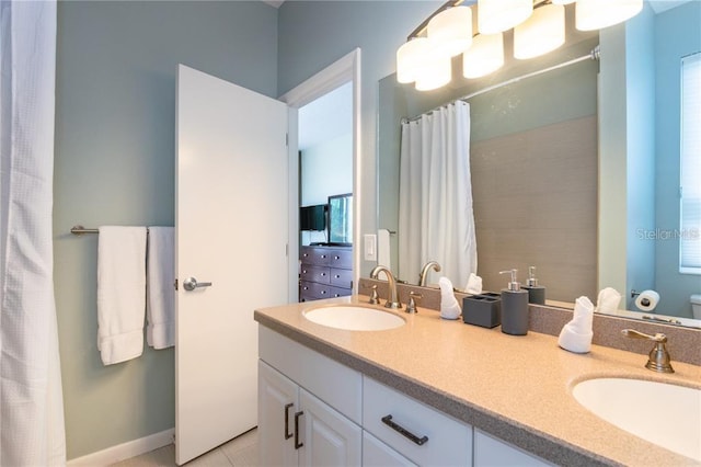 bathroom featuring toilet, dual bowl vanity, and tile patterned flooring