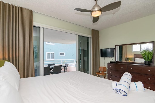 bedroom with ceiling fan, a textured ceiling, and a closet