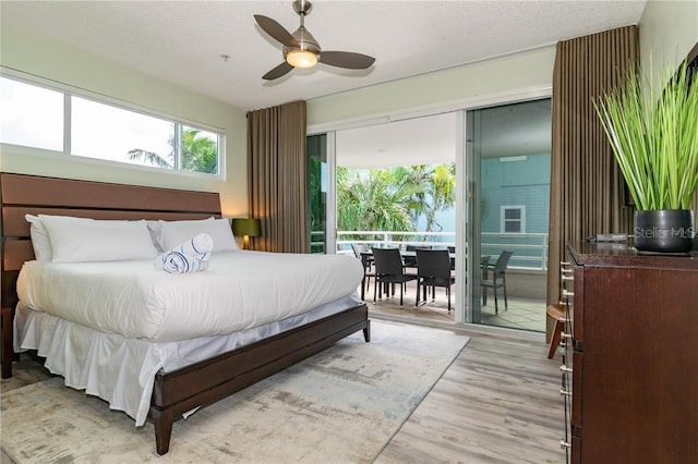 bedroom featuring ceiling fan, access to outside, and light hardwood / wood-style floors