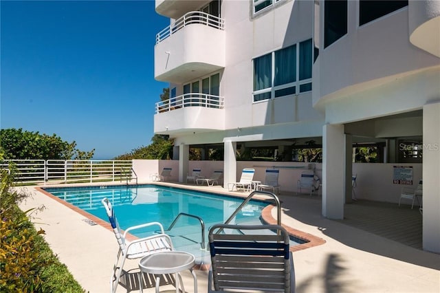 view of pool featuring a patio area