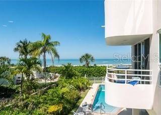 view of swimming pool with a water view