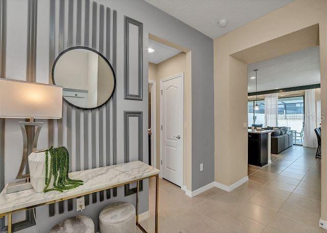 hallway featuring light tile patterned floors