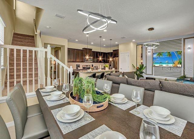 dining area featuring a textured ceiling