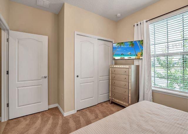 carpeted bedroom featuring a closet