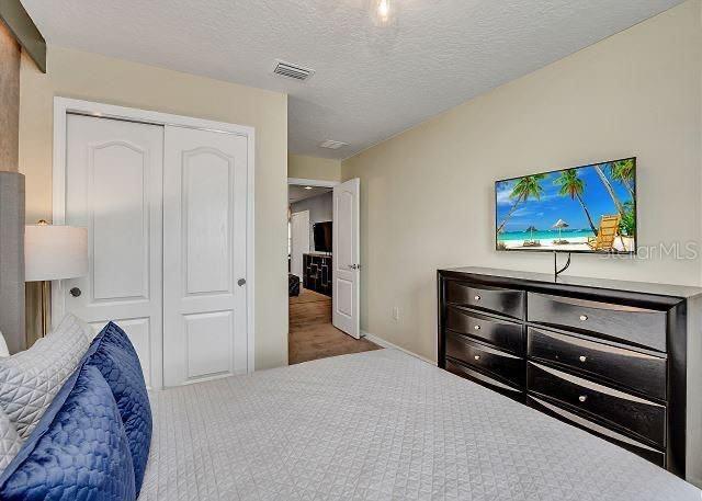 bedroom featuring a closet and a textured ceiling