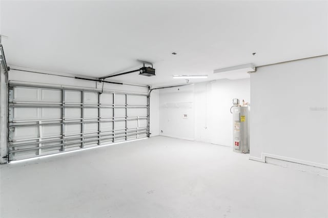 garage with electric water heater and a garage door opener