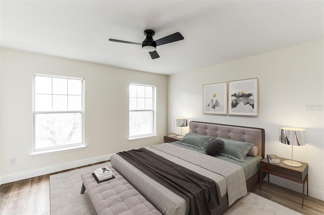 bedroom featuring ceiling fan and hardwood / wood-style floors