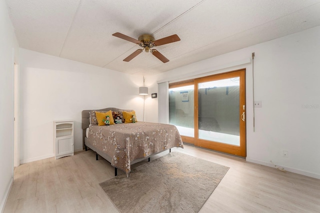 bedroom with ceiling fan, access to outside, and light hardwood / wood-style floors