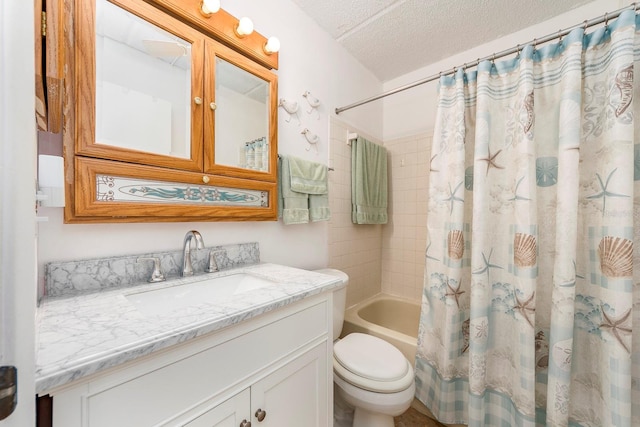 full bathroom with vanity, toilet, a textured ceiling, and shower / bath combo with shower curtain