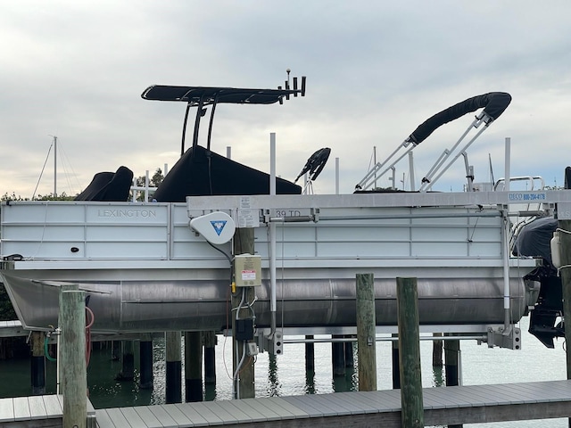 view of home's community featuring a water view and a boat dock