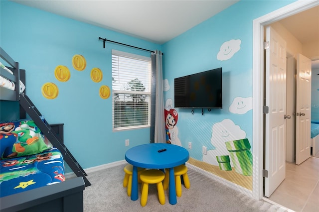 recreation room featuring light carpet