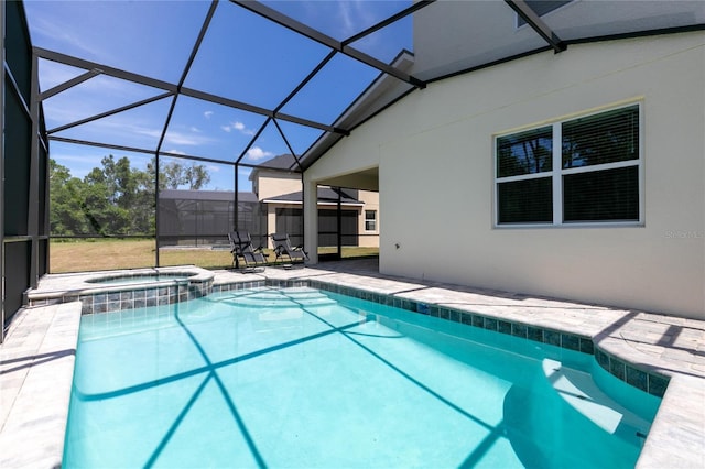 view of swimming pool featuring an in ground hot tub, a lanai, and a patio