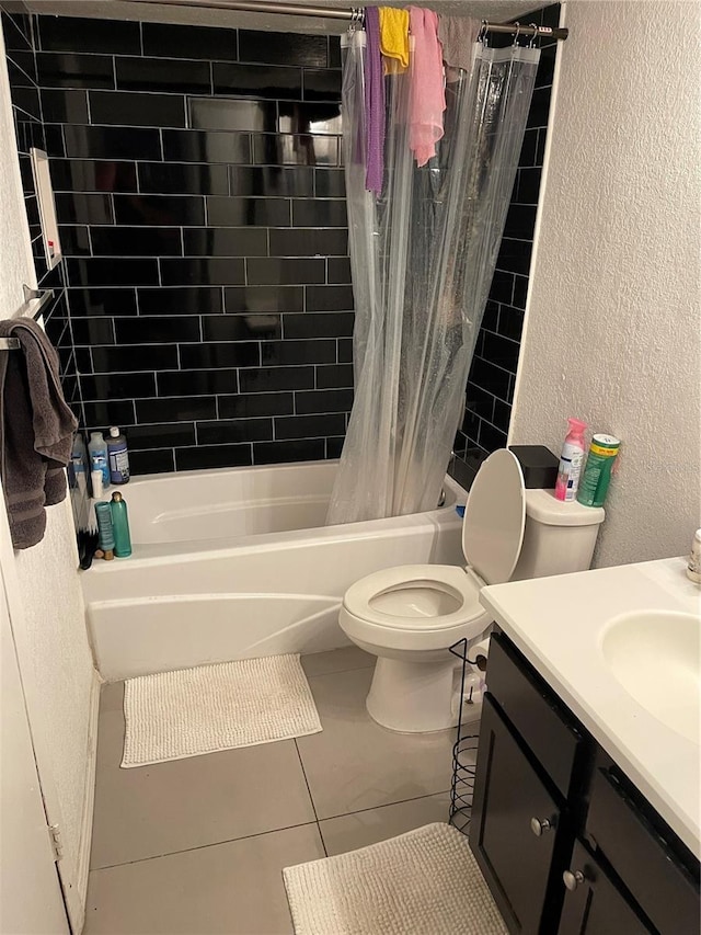 full bathroom featuring vanity, toilet, tile patterned floors, and shower / bath combination with curtain