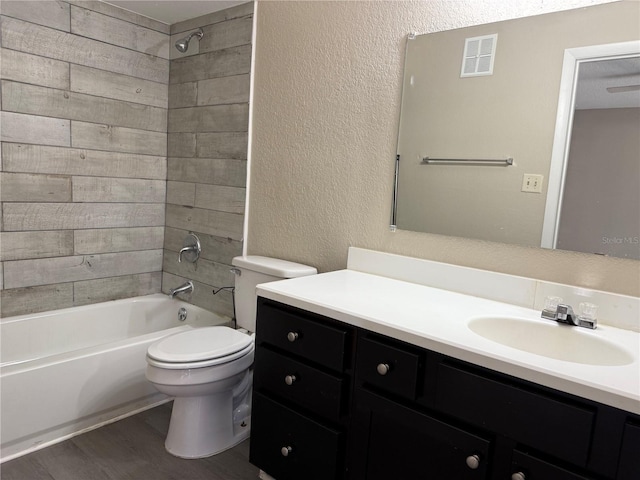 5635 Devonbriar Way Unit 103, Orlando, FL 32822 - bathroom with vanity, shower / bathing tub combination, toilet, visible vents, and wood finished floors