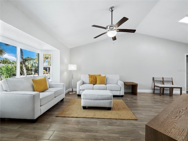 living room featuring vaulted ceiling and ceiling fan