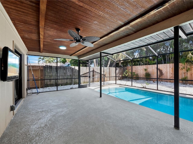 view of pool with a lanai, a patio area, and ceiling fan