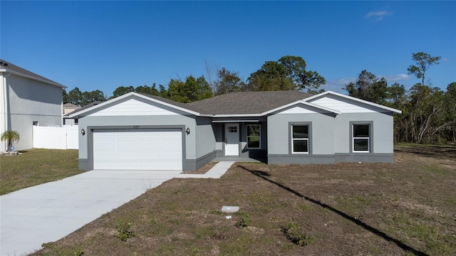 ranch-style house with a front lawn and a garage