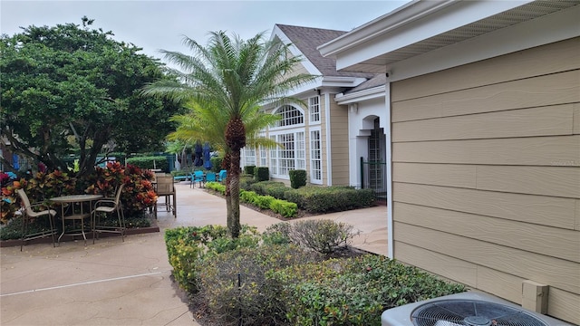 exterior space featuring a patio and cooling unit