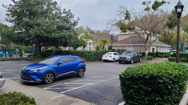 uncovered parking lot with fence