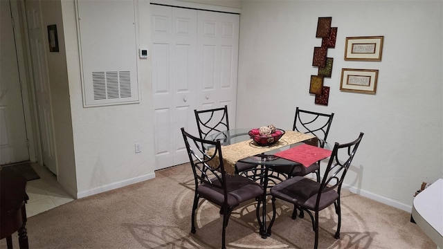 view of carpeted dining space