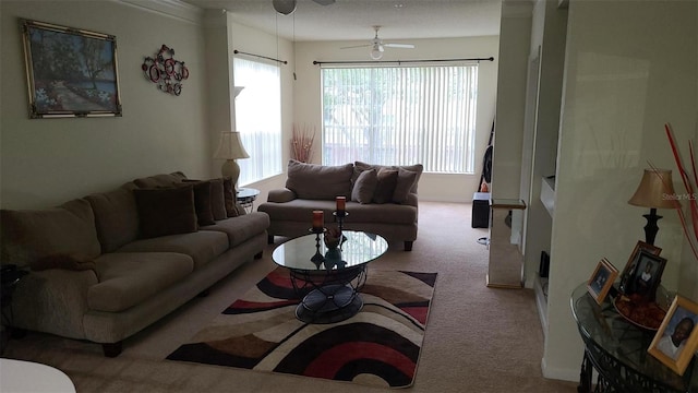 living room with a healthy amount of sunlight, a ceiling fan, and carpet flooring