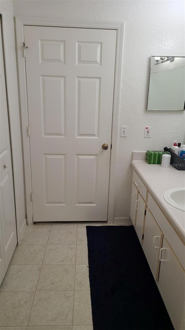 bathroom with vanity and tile patterned floors