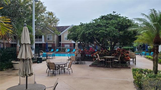 view of patio / terrace featuring a community pool