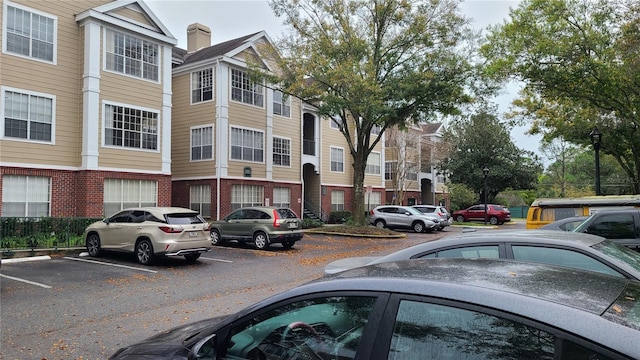 13103 Mulberry Park Dr Unit 824, Orlando, FL 32821 - view of building exterior with uncovered parking