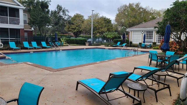 13103 Mulberry Park Dr Unit 824, Orlando, FL 32821 - community pool featuring a patio area
