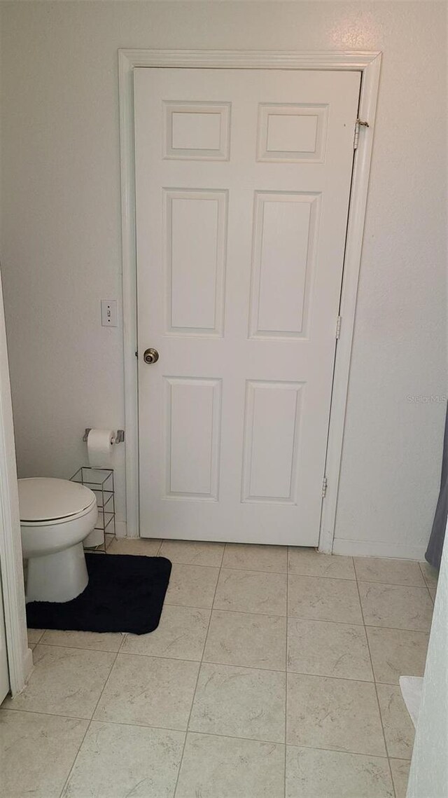 13103 Mulberry Park Dr Unit 824, Orlando, FL 32821 - bathroom featuring toilet and tile patterned floors