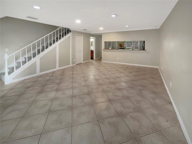 tiled empty room with ornamental molding