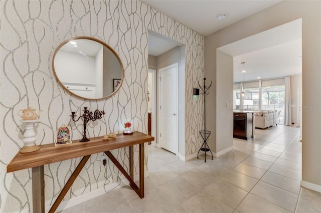 hall featuring light tile floors