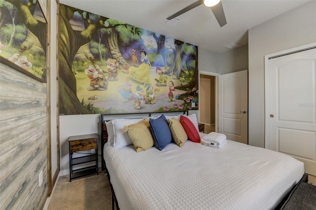 carpeted bedroom with a closet and ceiling fan