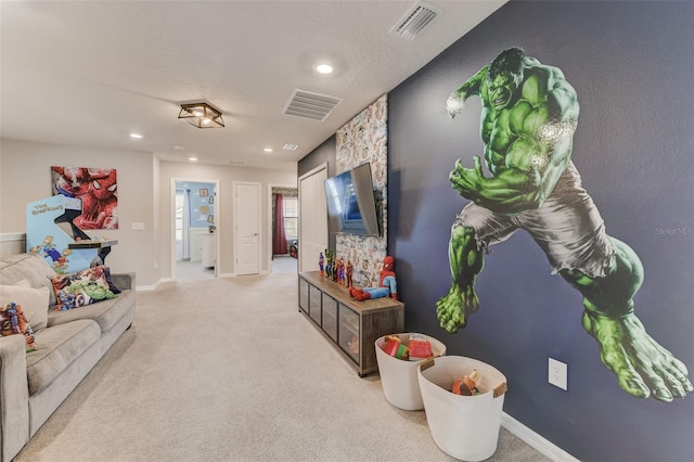 living room with light colored carpet and a textured ceiling