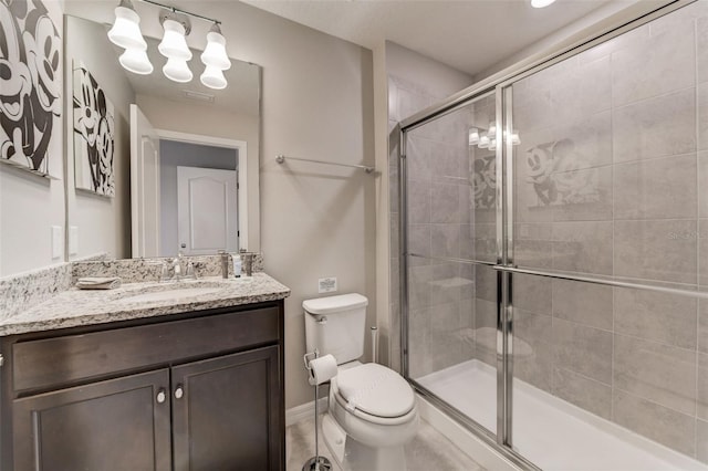 bathroom featuring toilet and vanity with extensive cabinet space