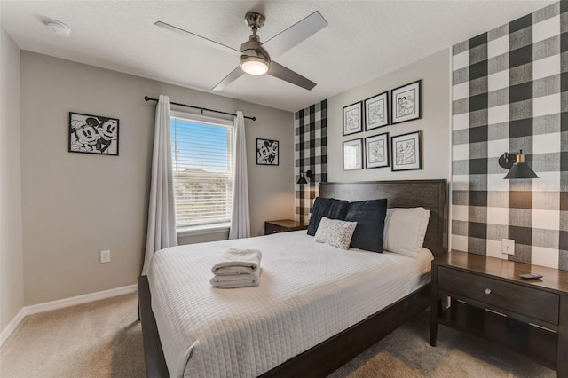 bedroom featuring dark carpet and ceiling fan