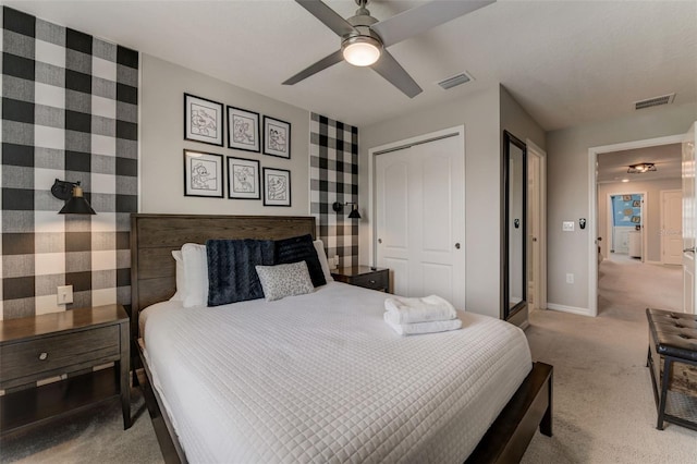 carpeted bedroom featuring a closet and ceiling fan