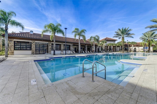 view of swimming pool featuring a patio