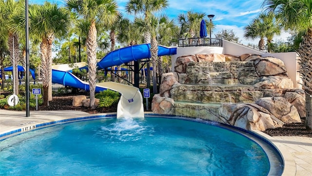 view of swimming pool featuring a water slide