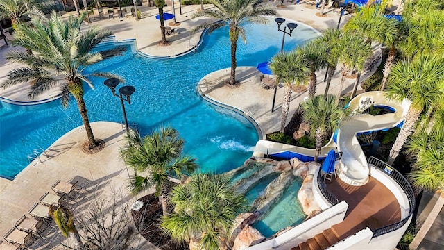 view of pool featuring a patio area and a hot tub