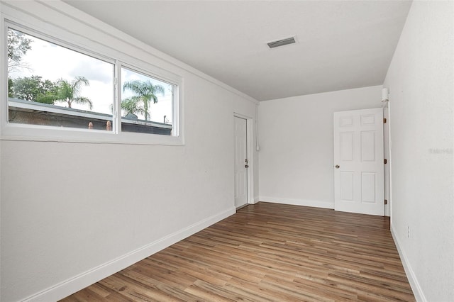 empty room featuring wood-type flooring