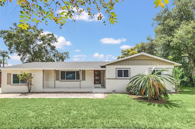 ranch-style home featuring a front yard