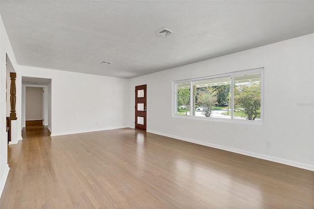 spare room featuring hardwood / wood-style floors