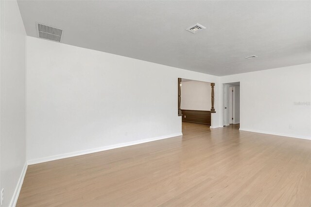 empty room with light hardwood / wood-style floors