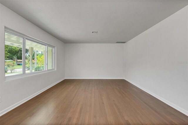 empty room featuring hardwood / wood-style flooring