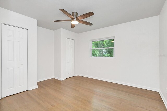 unfurnished bedroom featuring ceiling fan and wood-type flooring