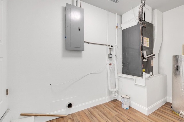 interior space featuring heating unit and electric panel