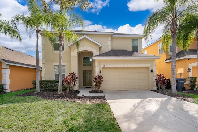 view of front of property with a front lawn and a garage