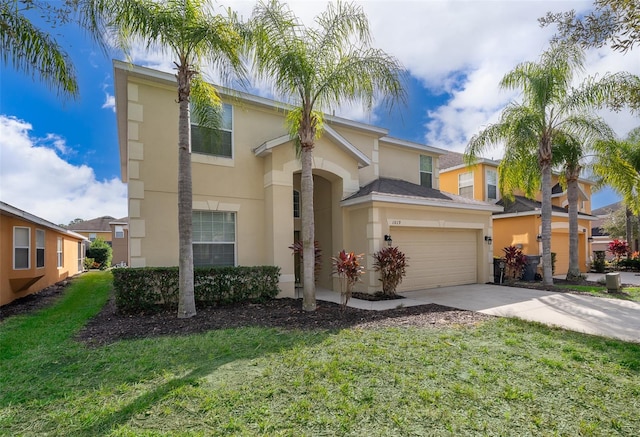 view of front of property featuring a front yard and a garage